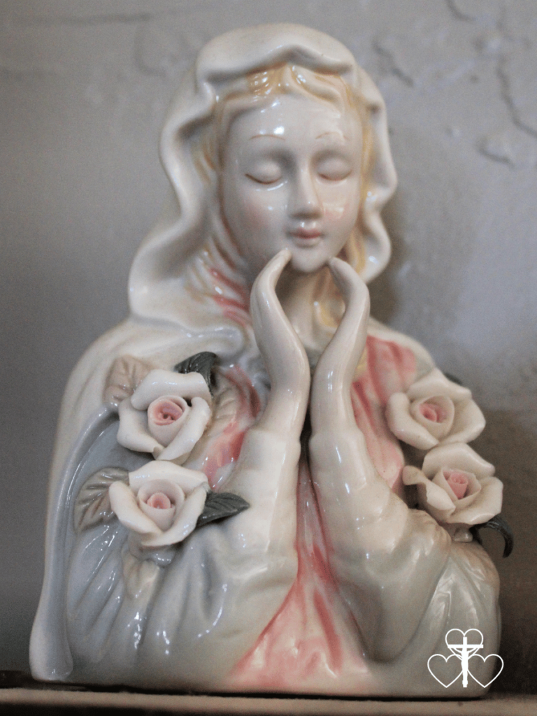 Picture of a glazed statue of mother Mary.